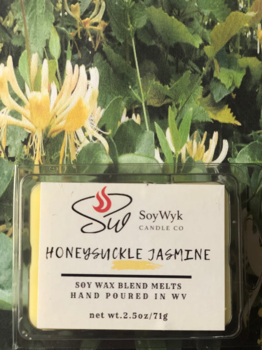 White Soy Wax Melt in a 2.5 oz clear package. Wax Melt in garden with honeysuckle bushes around them. Labeled as “Honeysuckle Jasmine”Featured fragrant notes are lemon, honeysuckle, jasmine, violet, wood 
Hand-poured in WV by SoyWyk Candle Co. 