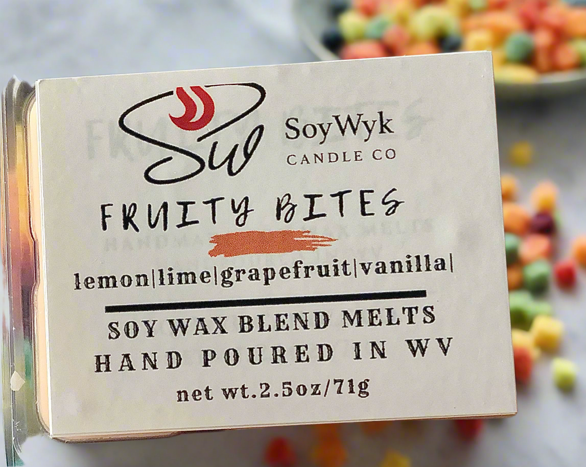White   Soy Wax Melt in a 2.5 oz clear package.  Wax melt on a ceramic counter with a bowl of multi color round cereal. Labeled as “Fruity Bites”. 
Featured fragrant notes are lemon, lime, grapefruit, vanilla 
Hand-poured in WV by SoyWyk Candle Co. 
