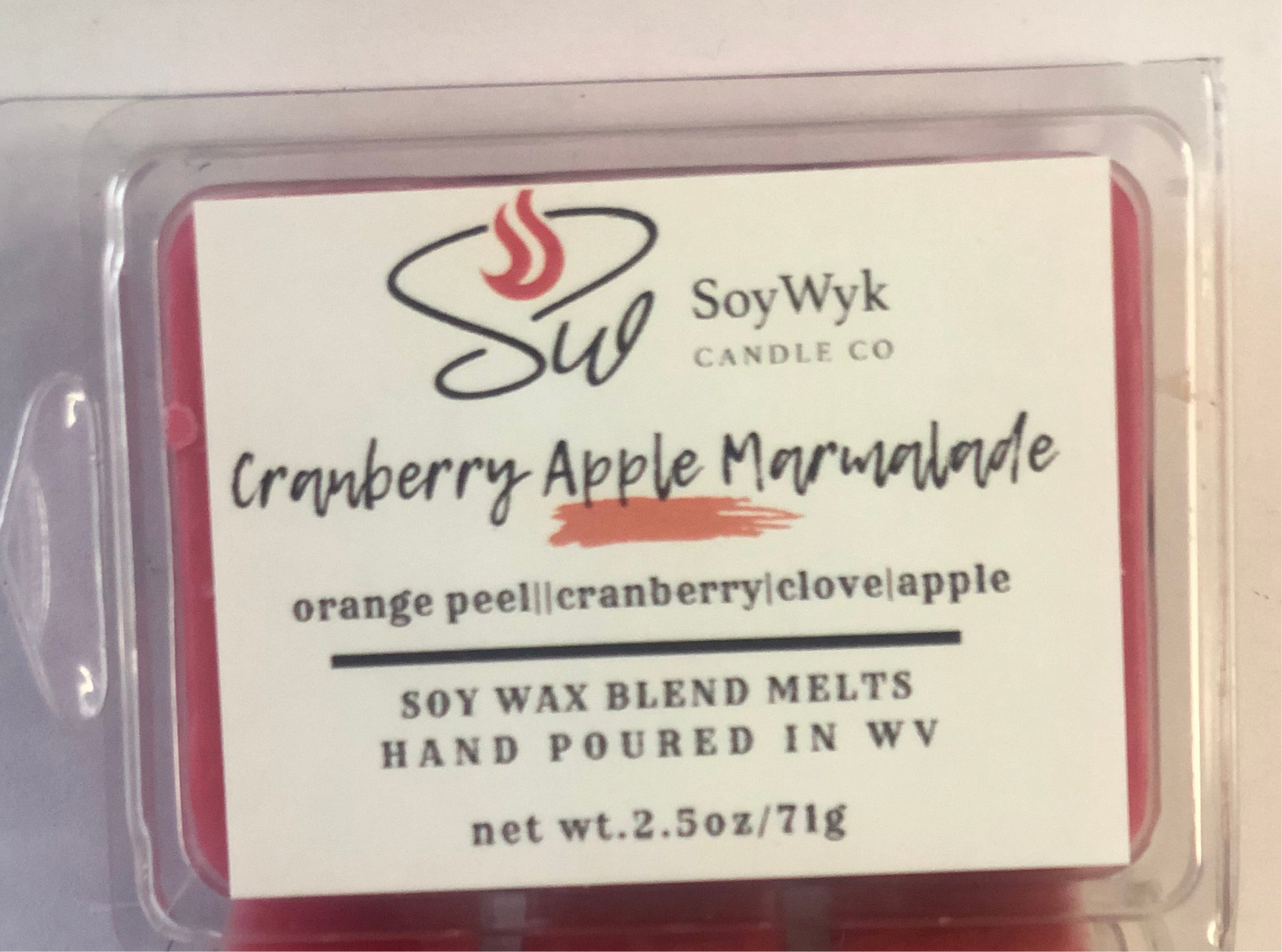 White Soy Wax Melt in a 2.5 oz clear package.  Wax melt on a white ceramic countertop in a modern kitchen few apples in view. Labeled as “Cranberry Apple Marmalade “.
Featured fragrant notes are orange peel, cranberry, apple, clove. 
Hand-poured in WV by SoyWyk Candle Co. 